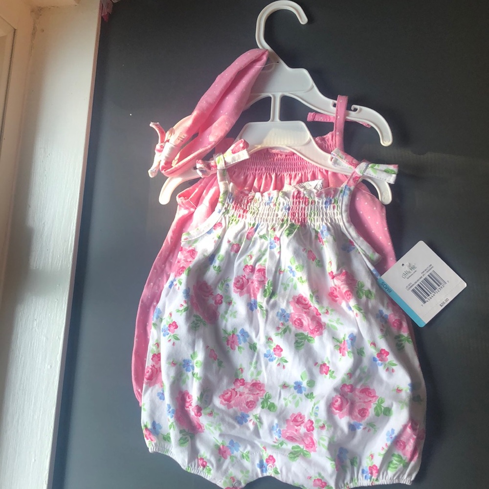 Never got the chance to put on. Cute 6 month infant romper/dress+ headband.